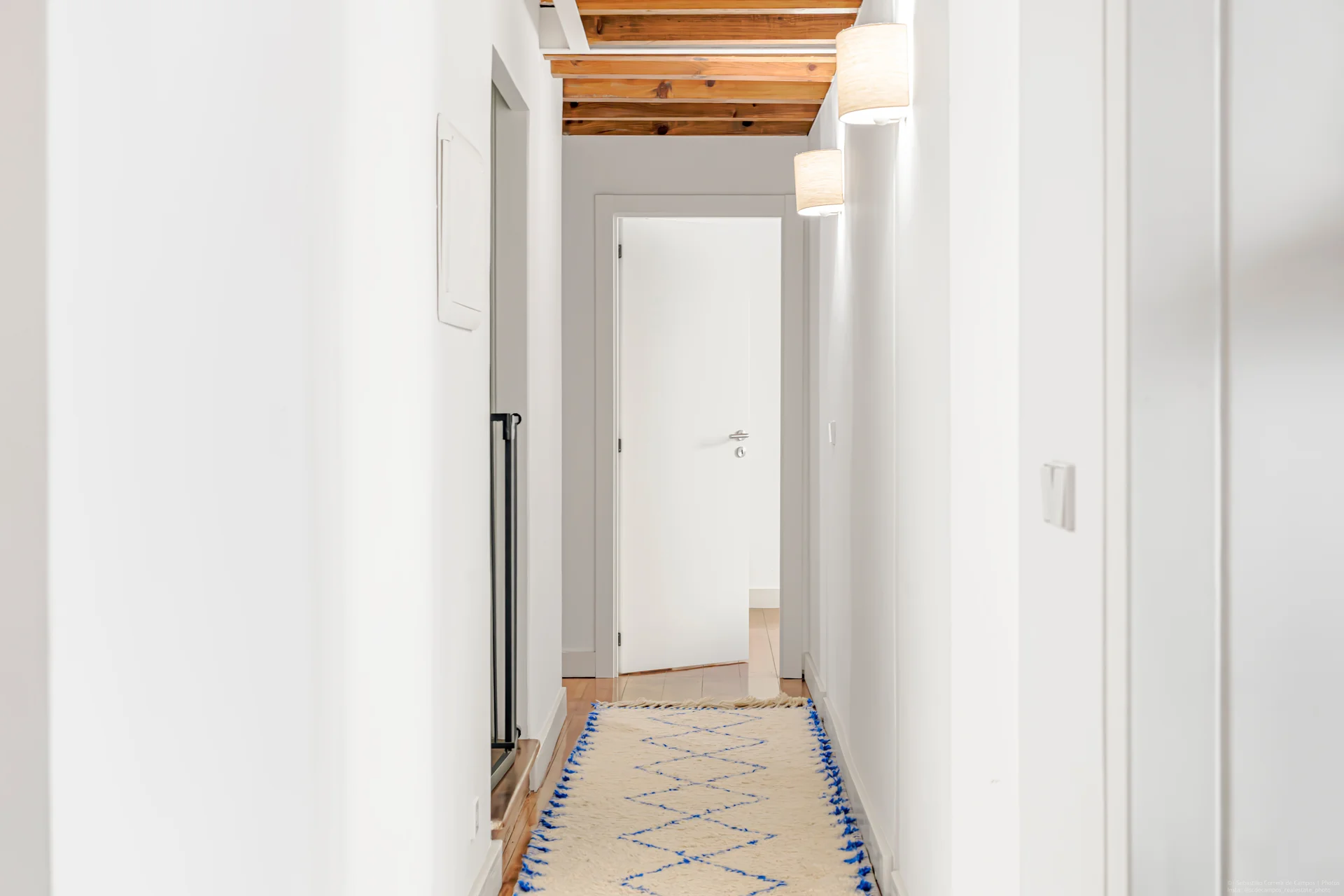 Hallway with exposed timber ceiling