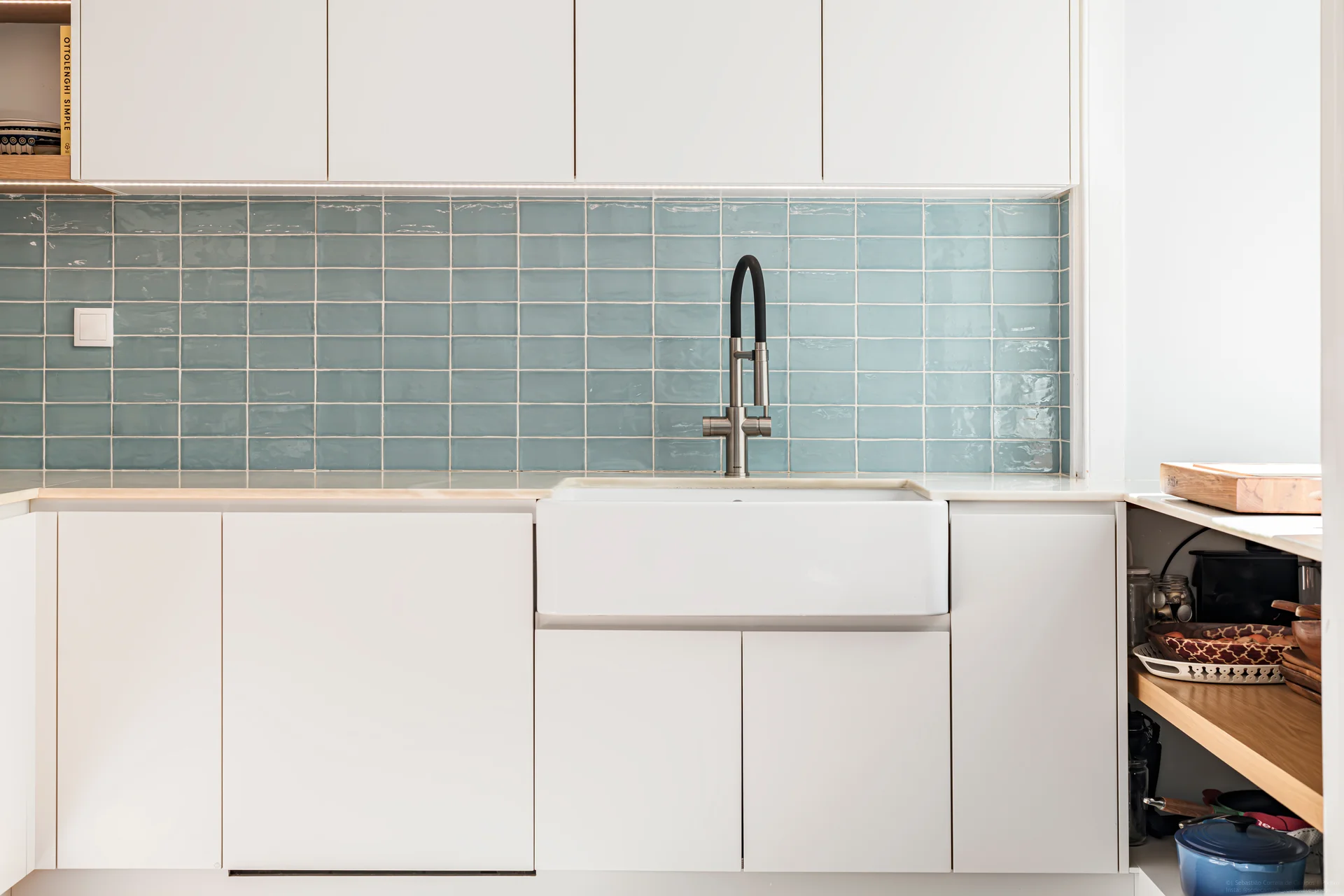 Kitchen with teal backsplash